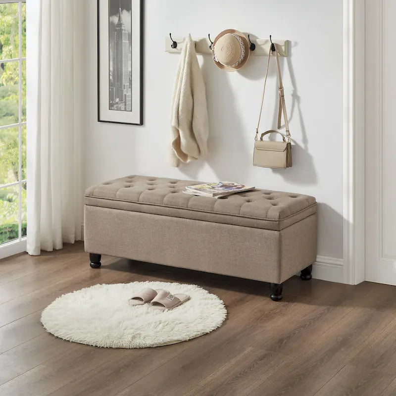 Banc de rangement capitonné avec pieds en bois tournés